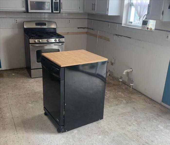 cabinets, flooring and appliances removed after water damage 