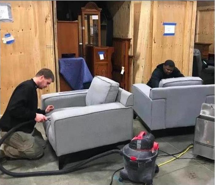 technicians cleaning gray furniture 